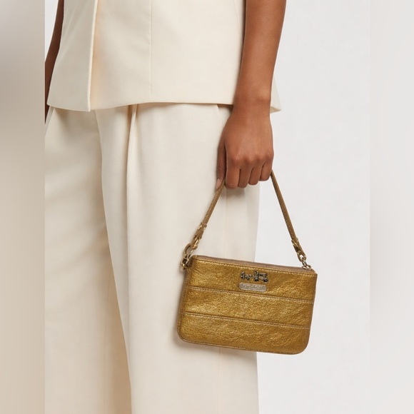 Coach Handbags - COACH gold Wristlet pouch